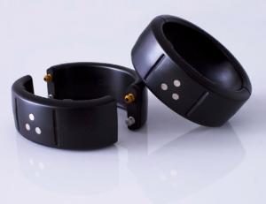 GEOSATIS electronic ankle bracelet &mdash; two black ring-shaped GPS units side by side